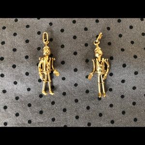Two gold dipped Pinocchio charms